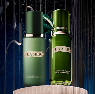 Close up of model cleansing skin, focusing on product texture on skin